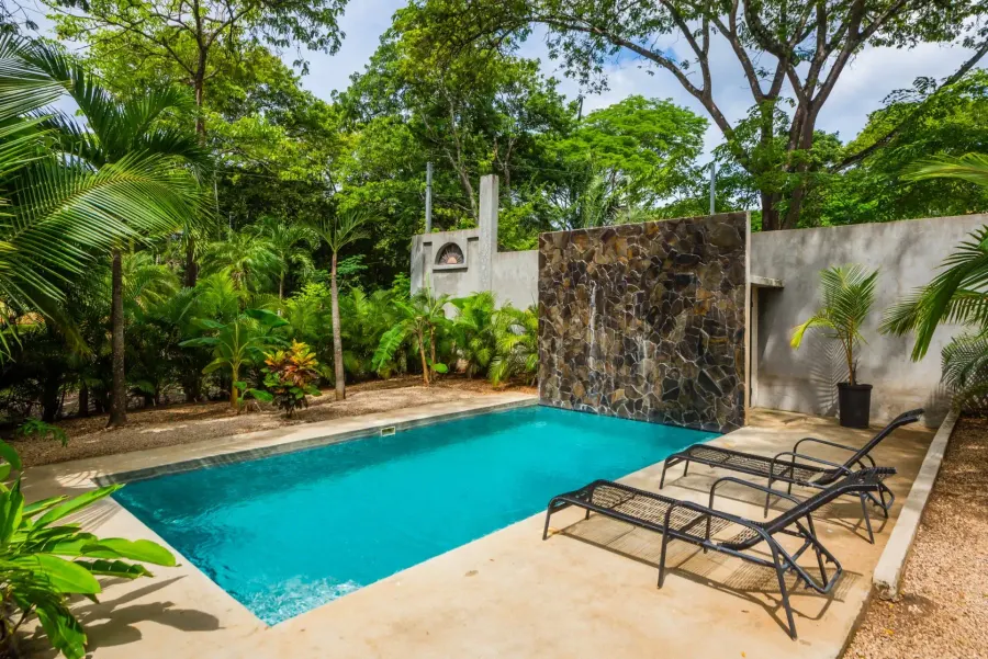 Aerial view of Casa Alice surrounded by tropical gardens in Playa Marbella