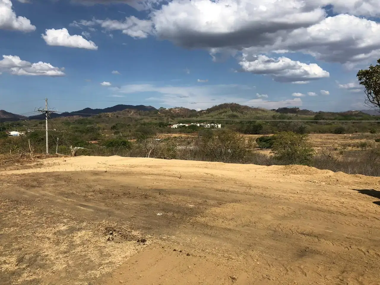 Flat cleared residential lot at the entrance of Los Jobos, Villarreal