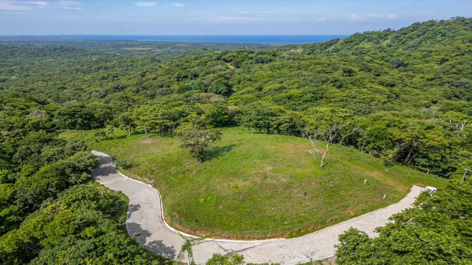 Forested hillside and cleared building plateau at The Enclave at Los Cielos